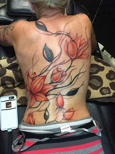 Explore skull cover up tattoo ideas, creative tattoo ideas in Anniston, available at Wicked Game Tattoo & Piercing Studio