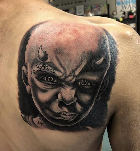 Explore concert tattoo ideas, creative tattoo ideas in Alamosa, available at The Shop Tattoo & Comics