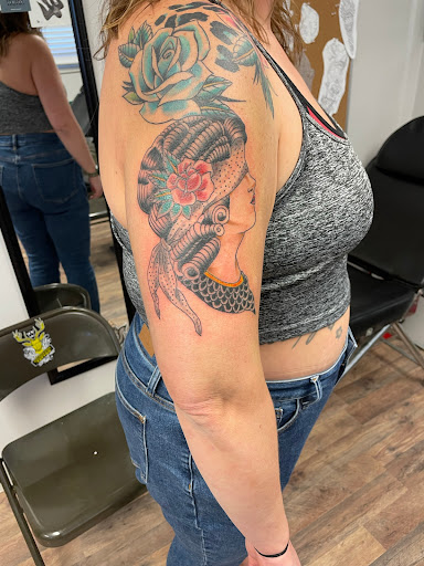 Explore skydiving tattoo ideas, creative tattoo ideas in Russell, available at AU Tattoo