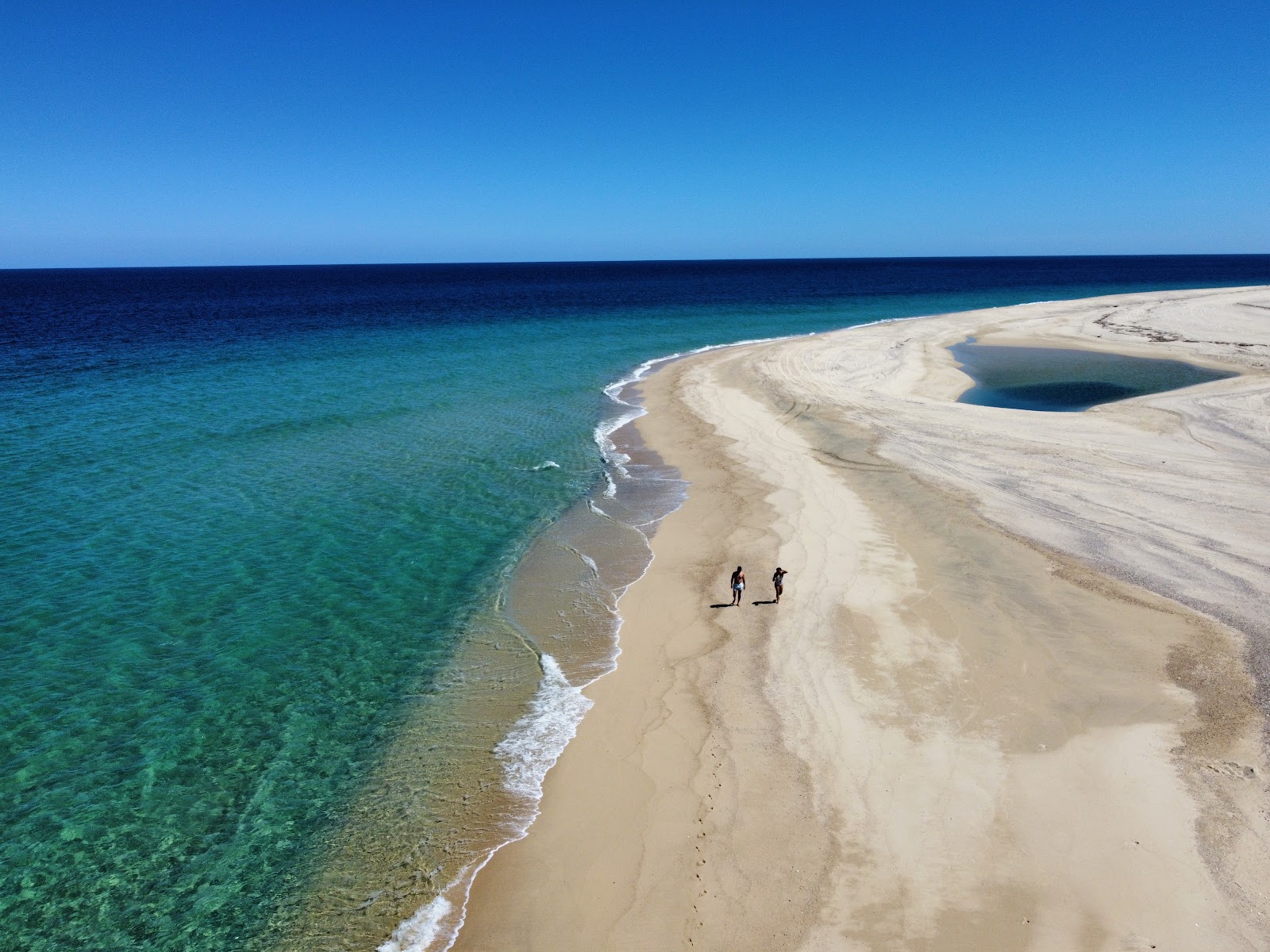 Photo de Playa Punta Arena avec sable fin et lumineux de surface