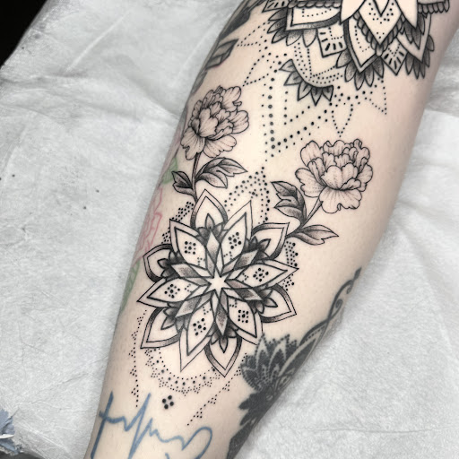 Explore small neck tattoo ideas, creative tattoo ideas in Edgewood, available at Wild Coyote Tattoo