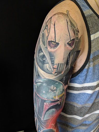 Explore curious george tattoo ideas, creative tattoo ideas in Bradenton, available at Sacred Arts Tattoo Bradenton