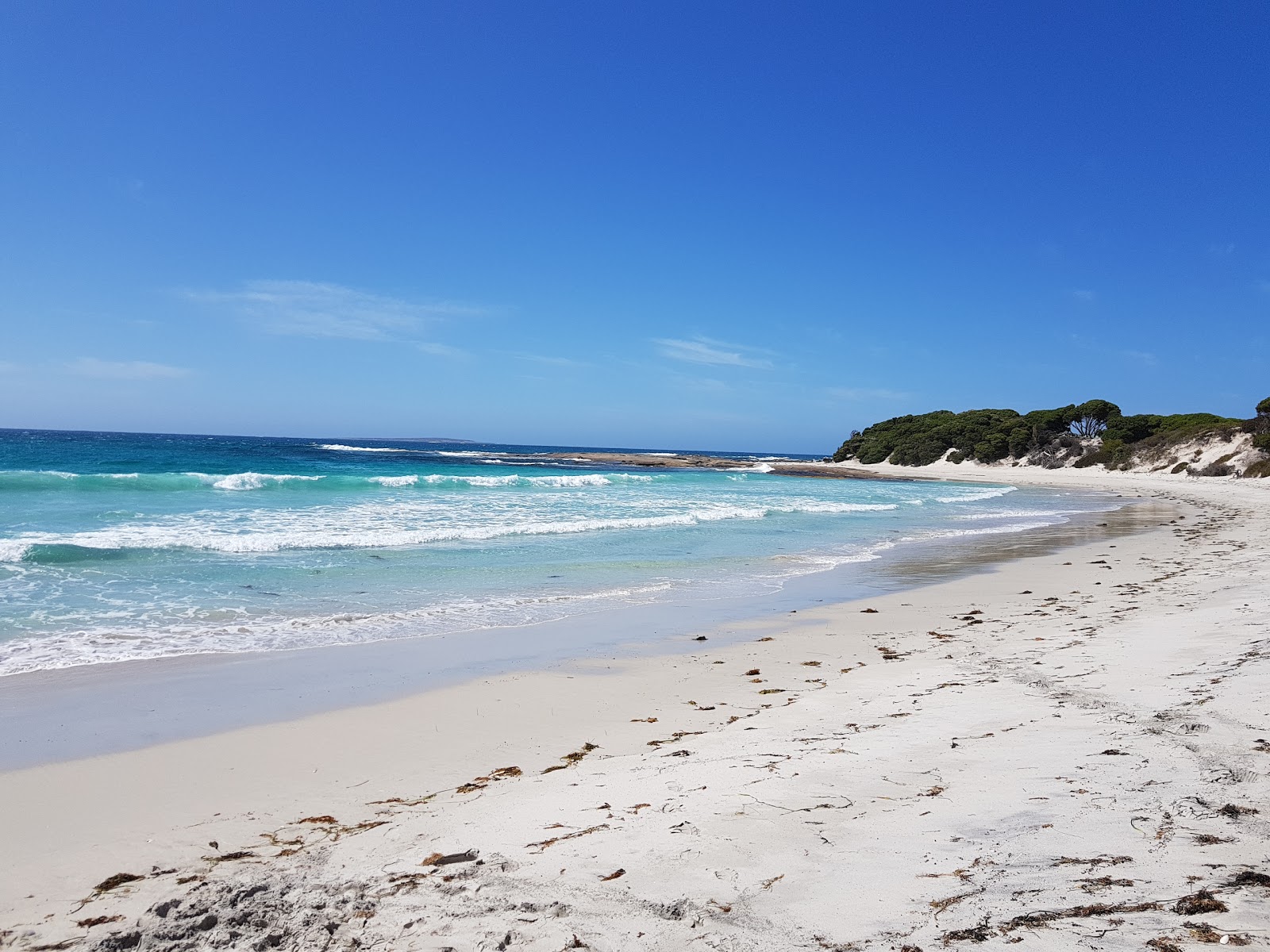 Foto van Quagi Beach met beige zand oppervlakte