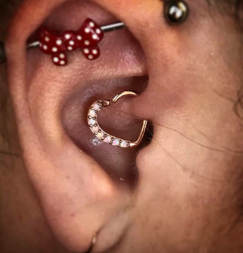 Explore small hand tattoo ideas, creative tattoo ideas in Nashville, available at Queen of Hearts Tattoos & Body Piercing