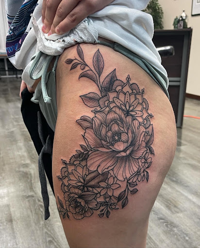 Explore cross stitch tattoo ideas, creative tattoo ideas in Graham, available at Transcendence Art Studio & Tattoo