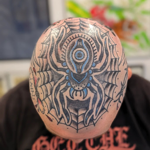 Explore head tattoo ideas for men, creative tattoo ideas in Bargersville, available at Angels and Demons Tattoo