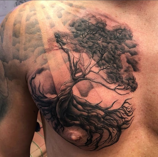 Explore tattoo ideas for black men, creative tattoo ideas in Galena, available at Emerald Buddha Tattoo