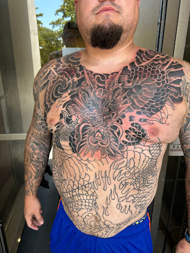 Explore mens back shoulder tattoo ideas, creative tattoo ideas in Miami, available at Bonsai Mike Tattoos