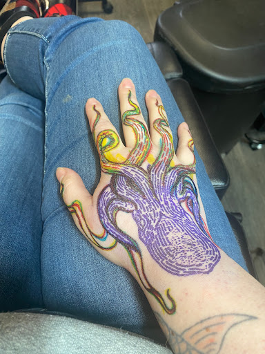 Explore coy fish tattoo ideas, creative tattoo ideas in Wasilla, available at Doulos Tattoo, The Tattoo Shop