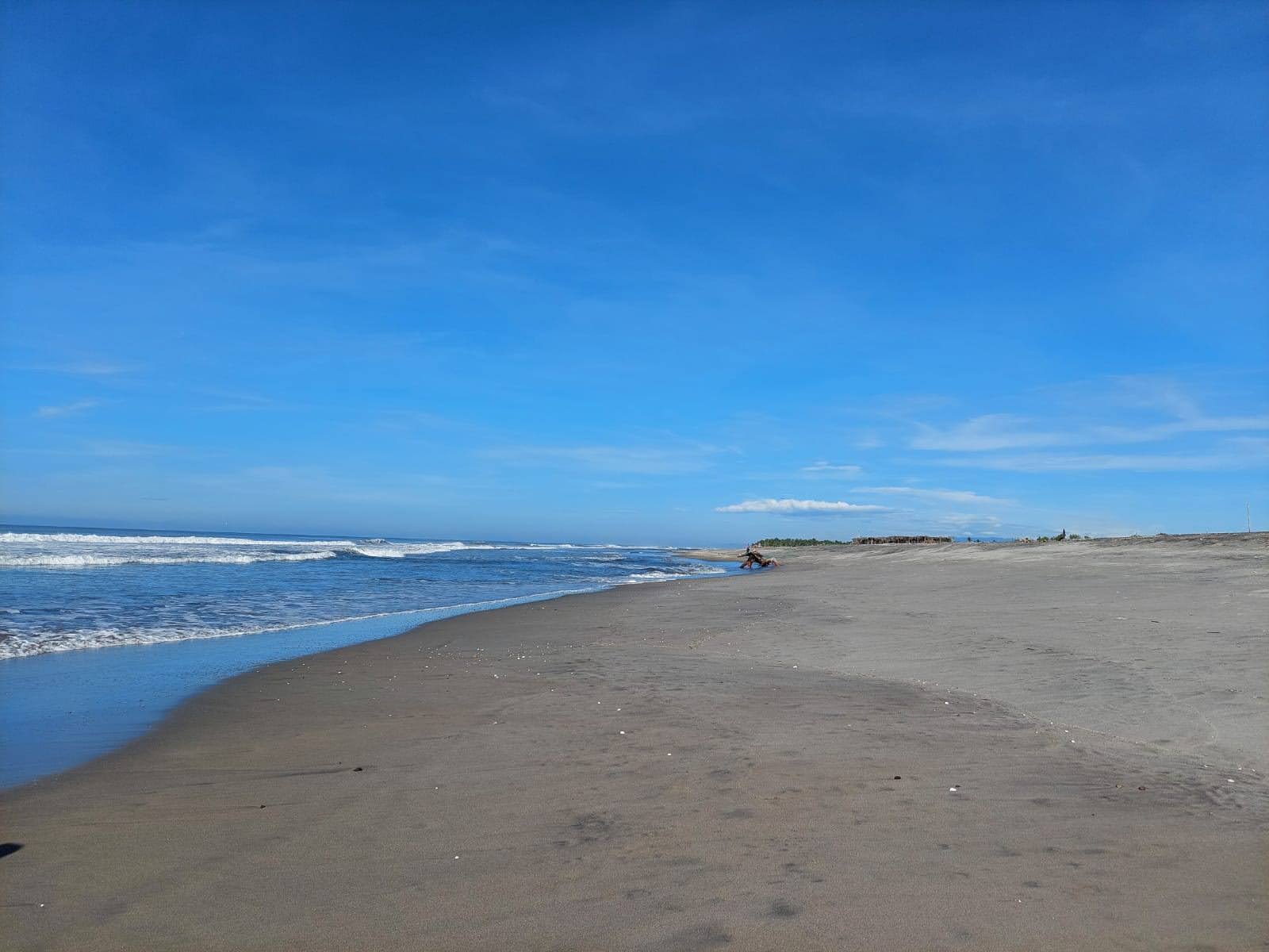 Fotografija San Marcelino beach z siv pesek površino