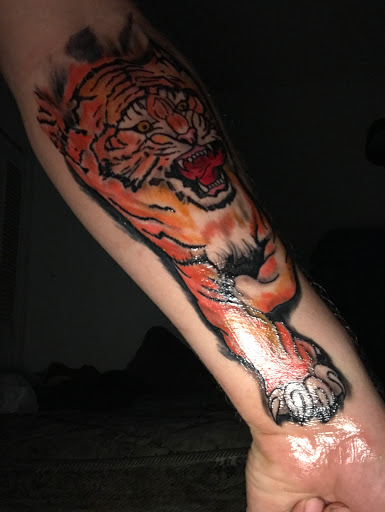 Explore lion tattoo ideas for guys, creative tattoo ideas in Bradenton, available at Memory Lane Tattoo Co.