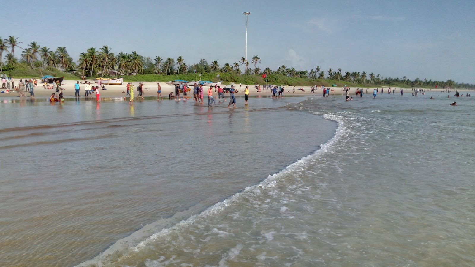 Foto di Colva Beach con una superficie del sabbia luminosa