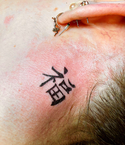 Explore flower spine tattoo ideas, creative tattoo ideas in North Tonawanda, available at Dark Side Ink Tattoo Studio