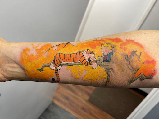 Explore wrap around arm tattoo ideas, creative tattoo ideas in Des Moines, available at Skin Kitchen Tattoo