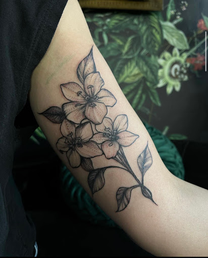 Explore red hand tattoo ideas, creative tattoo ideas in Buffalo, available at True Gloom Tattoo Studio
