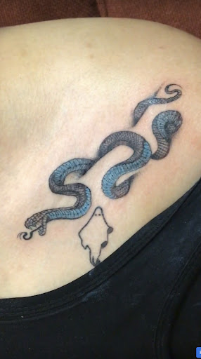 Explore tramp stamp lower back tattoo cover up ideas, creative tattoo ideas in Naples, available at IndigenousTinta tattoo studio