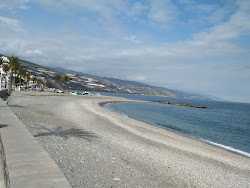 Foto von Playa Castell del Ferro und die siedlung