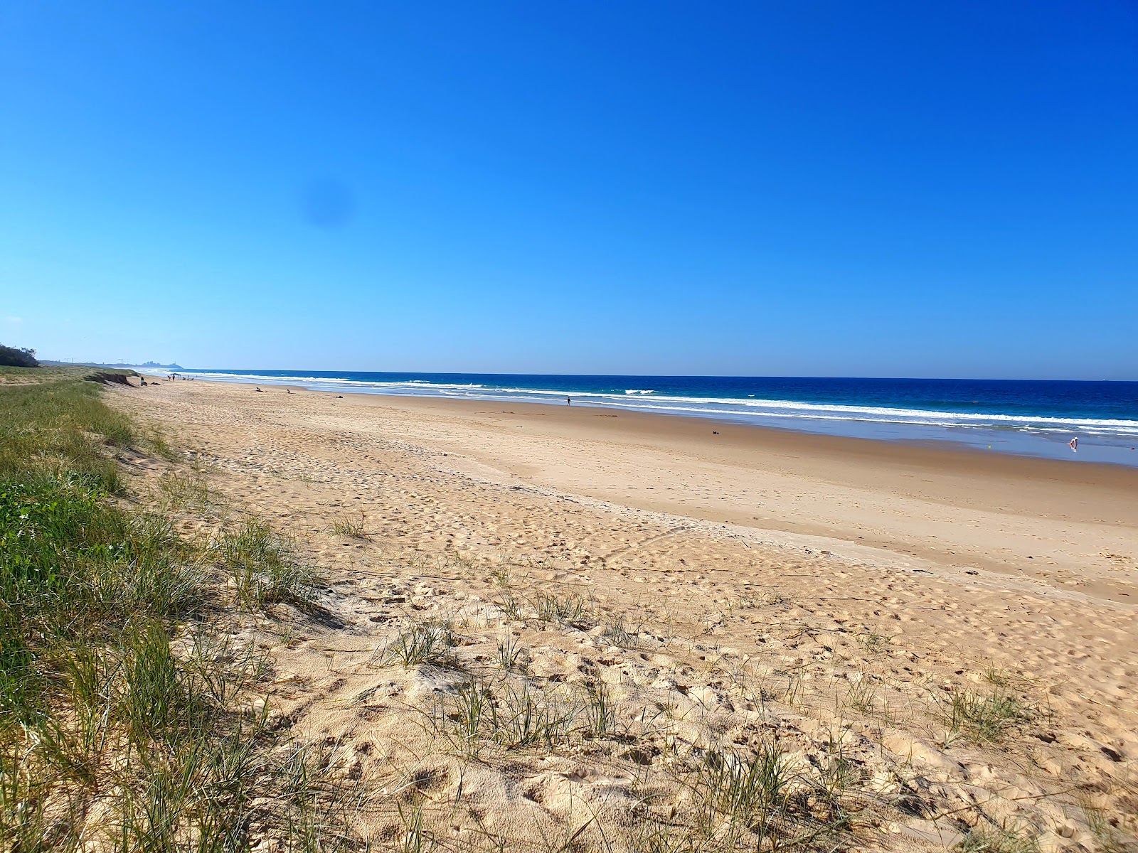 Foto van Wurtulla Beach met helder zand oppervlakte
