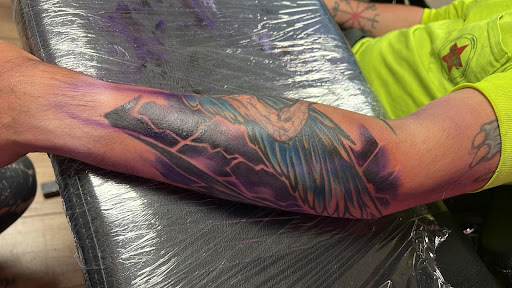 Explore outside arm tattoo ideas, creative tattoo ideas in Jefferson, available at Slammin Ink Tattoo