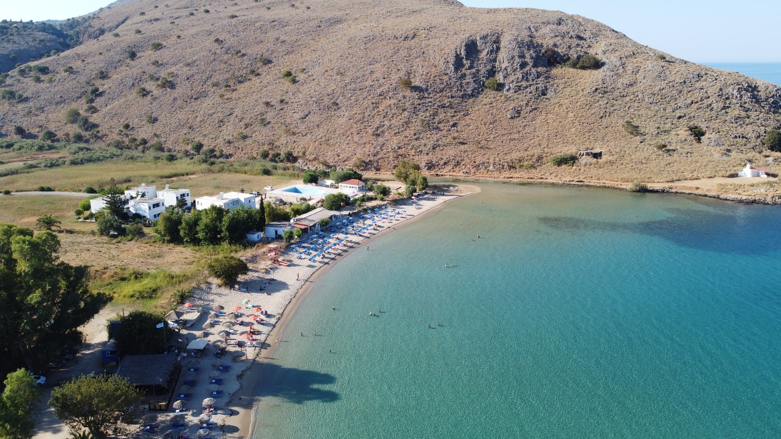 Foto av Kalyvaki Stranden med fin beige sand yta