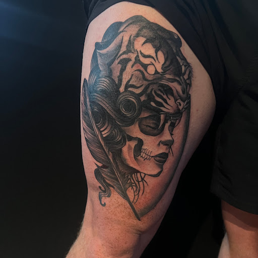 Explore front neck tattoo ideas, creative tattoo ideas in Buffalo, available at True Gloom Tattoo Studio