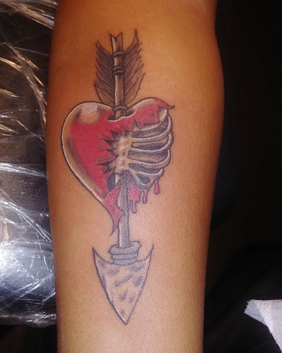 Explore tribal cross tattoo ideas, creative tattoo ideas in Redford, available at Prime Tattoo & Beauty