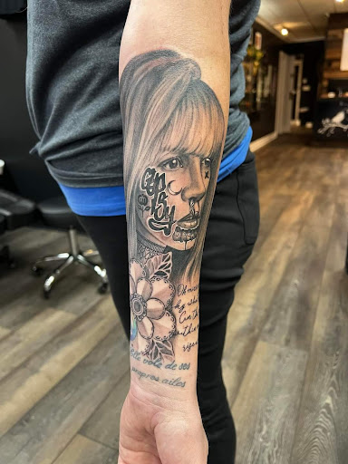 Explore military dog tag tattoo ideas, creative tattoo ideas in Dubuque, available at The Crows Nest