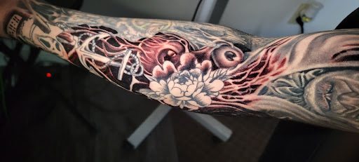 Explore tattoo ideas for hippies, creative tattoo ideas in Angola, available at Hoodlum Ink