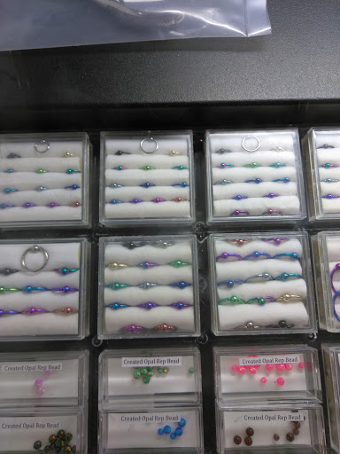 Explore name cover up tattoo ideas for men, creative tattoo ideas in Minneapolis, available at Almost Famous Body Piercing