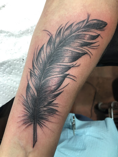 Explore knee surgery tattoo ideas, creative tattoo ideas in Sedona, available at Physical Graffiti Tattoo