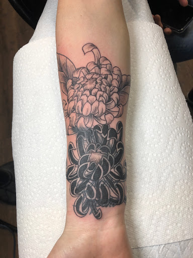 Explore water lily tattoo ideas, creative tattoo ideas in Mount Juliet, available at Division Street Tattoo Company