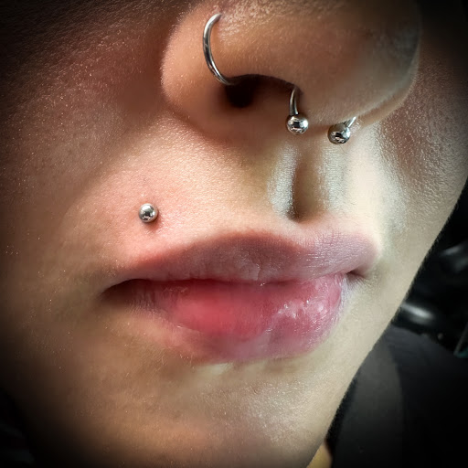 Find tattoo ideas on leg for your next unique tattoo in Bay Shore at Piercings By Dean 95