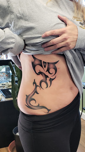 Explore ear tattoo ideas for women, creative tattoo ideas in Santa Fe, available at Rivers Collective Body Art