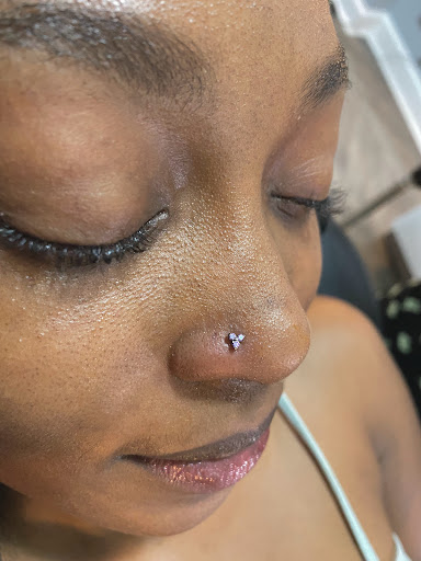 Explore roman numeral tattoo ideas for females, creative tattoo ideas in Saint Paul, available at Electric Strawberry Piercing