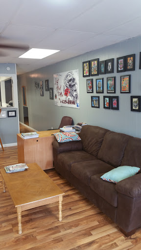 Find lion hand tattoo ideas for men for your next unique tattoo in Fayette at Last Stand Tattoo