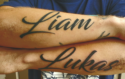 Explore black power tattoo ideas, creative tattoo ideas in Denison, available at Calypso Tattoo