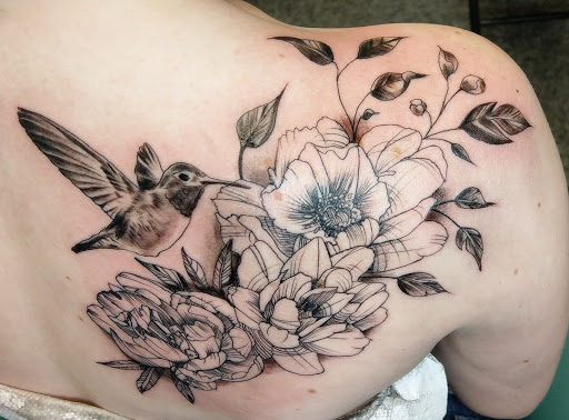 Explore hood tattoo ideas for men, creative tattoo ideas in Saint Paul, available at Iron Rhino Tattoo