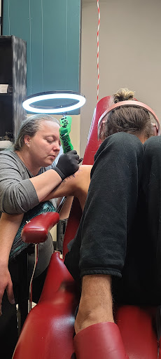 Explore full sleeve tattoo ideas for woman, creative tattoo ideas in Cabot, available at Painted Elephant Studio Tattoos & Piercing Shop