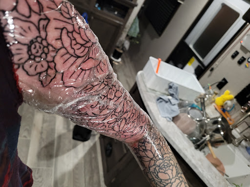 Explore women's leg tattoo ideas, creative tattoo ideas in Mckinney, available at Anvil Tattoo