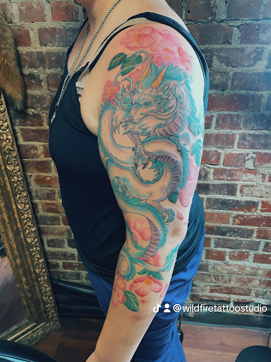 Explore tattoo hand ideas, creative tattoo ideas in Walnut Cove, available at Wildfire Tattoo Studio