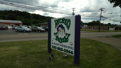 Explore tattoos on hand ideas, creative tattoo ideas in Minerva, available at Wicked Tattooz