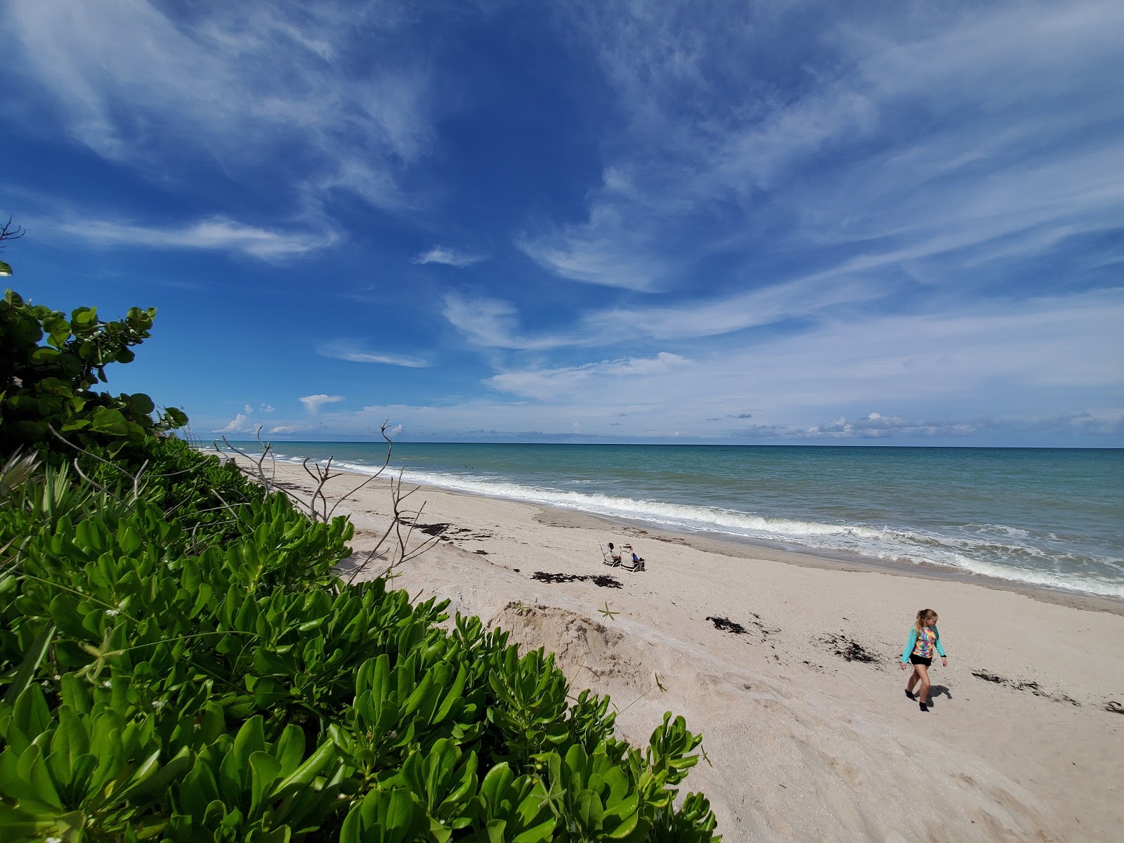 Fotografie cu Turtle beach cu o suprafață de nisip strălucitor