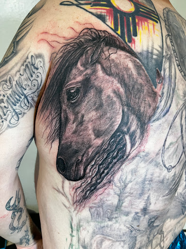 Explore asian sleeve tattoo ideas, creative tattoo ideas in Elko, available at Freedom Tattoo
