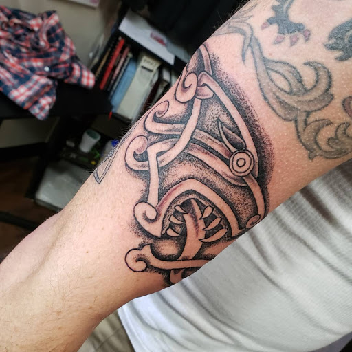 Explore tattoo ideas for him and her, creative tattoo ideas in Frisco, available at Frisco Tattoo Company - Steel PaintBrush