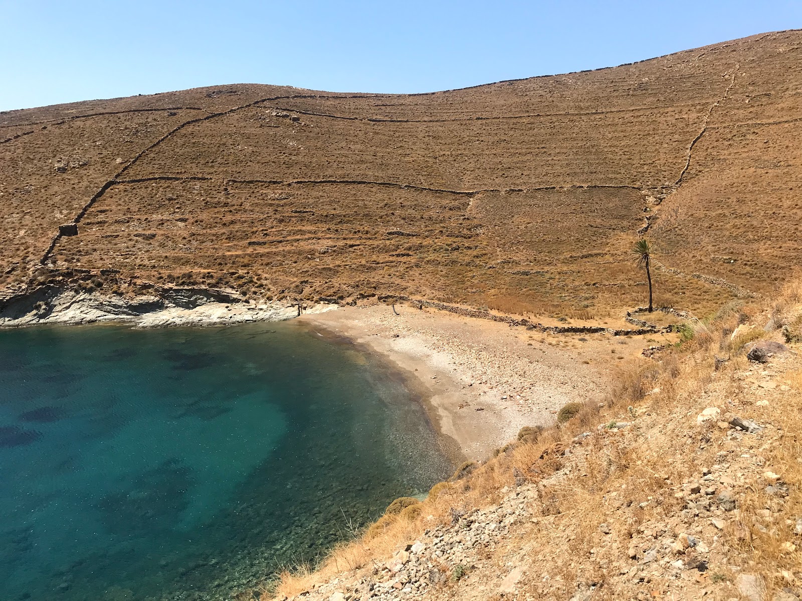 Photo of Kalogeros with black sand & pebble surface