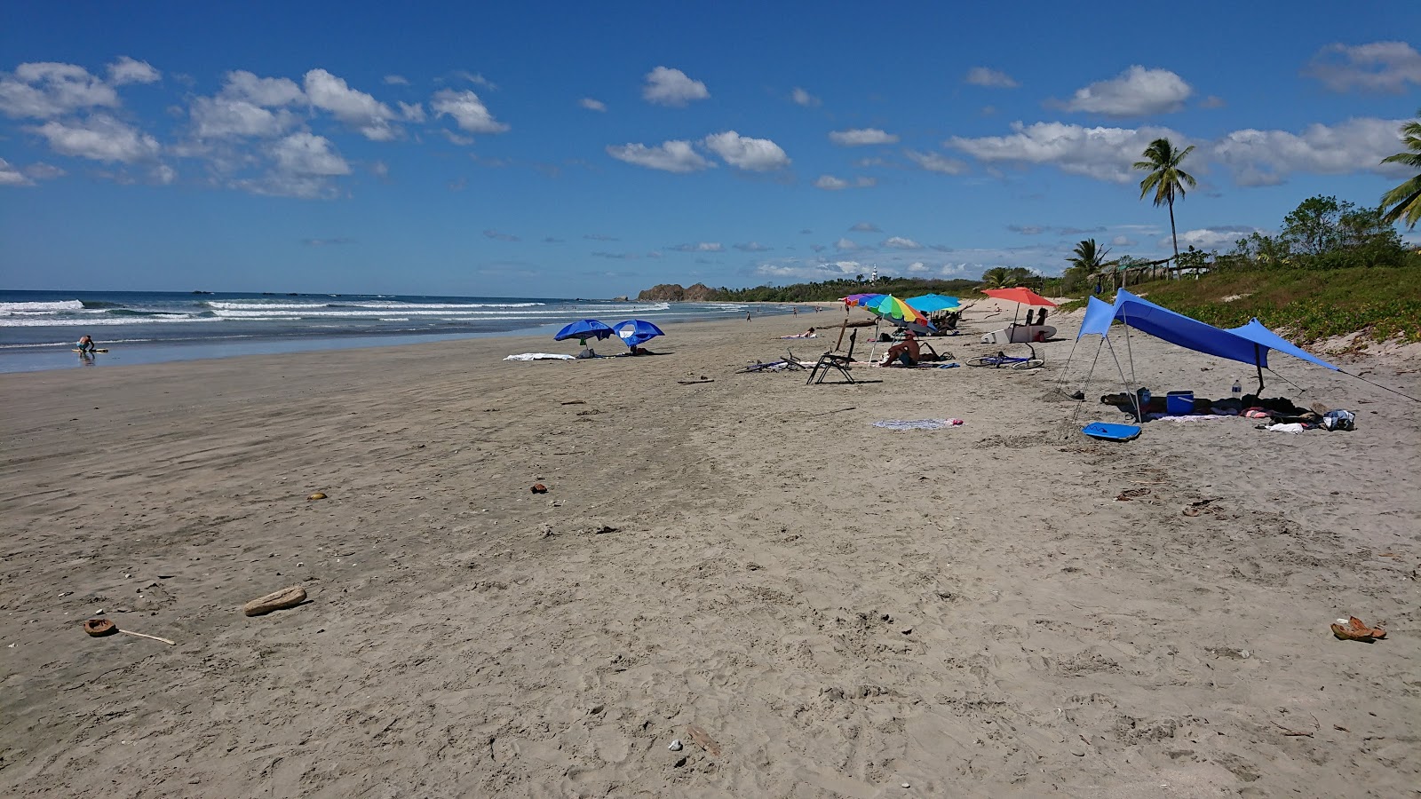 Foto av Playa Guiones med lång rak strand