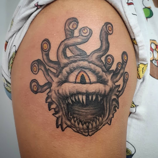 Explore shoulder blade tattoo ideas, creative tattoo ideas in Kansas City, available at Golden Stag Tattoo and Gallery