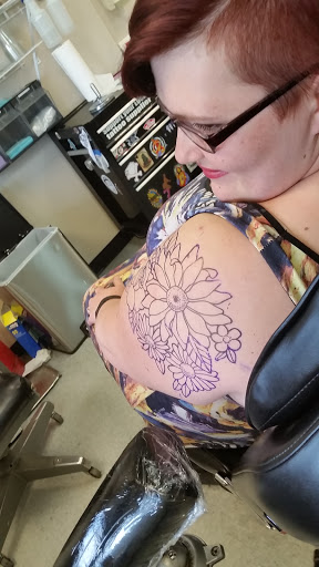 Explore trumpet tattoo ideas, creative tattoo ideas in Anchorage, available at Body Piercing Unlimited