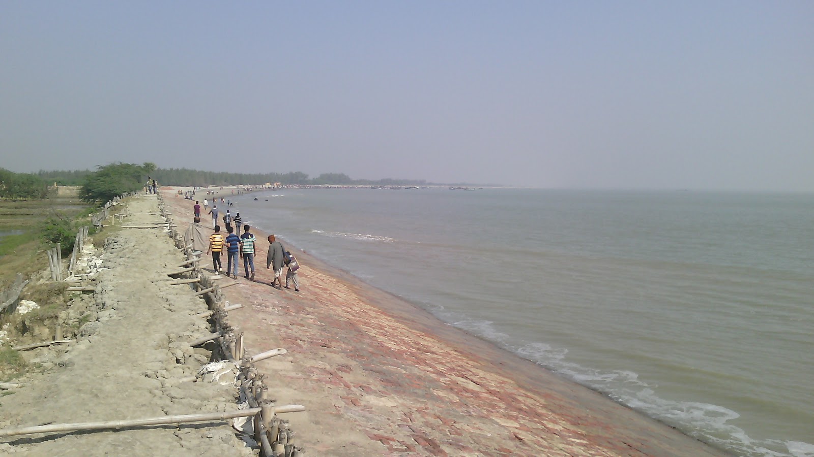 Foto de Gobardhanpur Beach com reto e longo