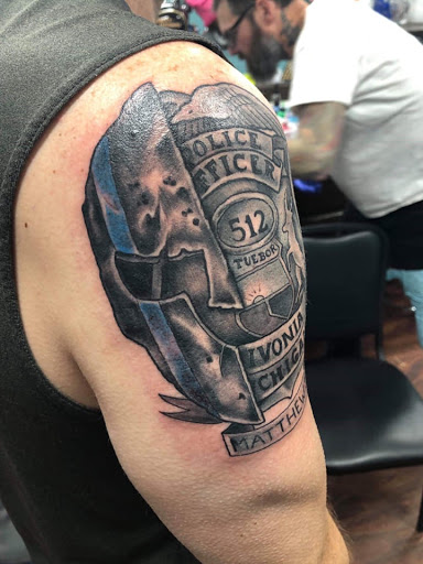 Find tattoo ideas crown for your next unique tattoo in Houghton Lake at Screaming Eagle Tattoo